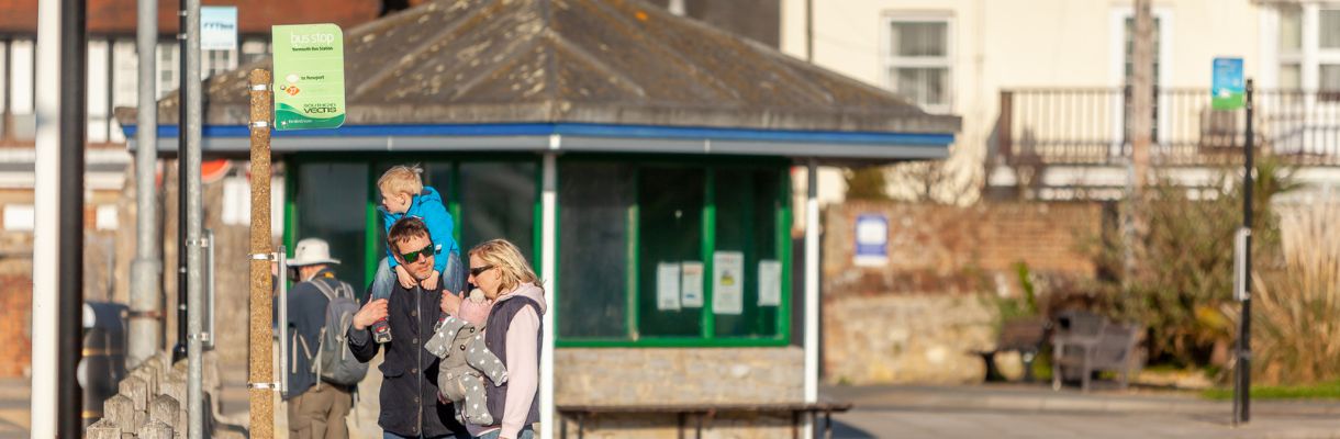 Family at bus stop in Yarmouth